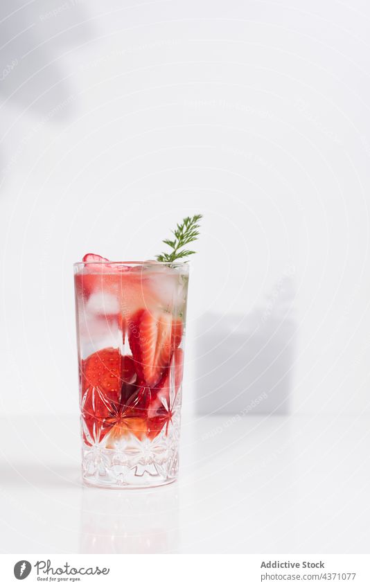 Detox drink with fresh strawberry infuse water detox cold glass summer beverage natural refreshment delicious tasty minimal simple vitamin healthy liquid serve