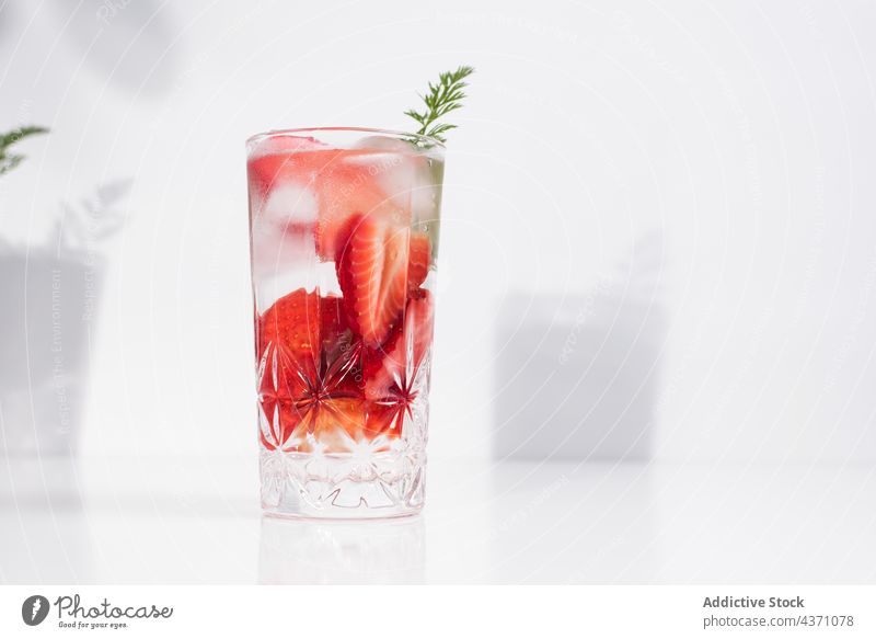 Detox drink with fresh strawberry infuse water detox cold glass summer beverage natural refreshment delicious tasty minimal simple vitamin healthy liquid serve