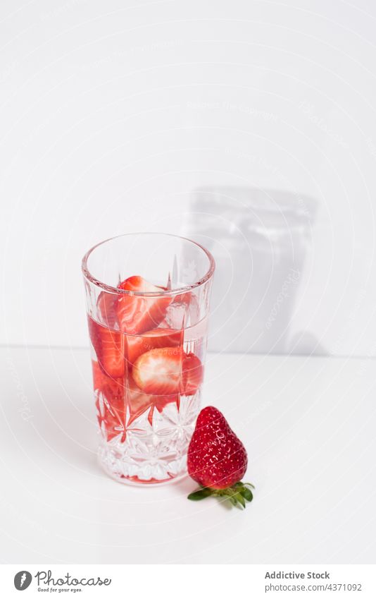 Detox drink with fresh strawberry infuse water detox cold glass summer beverage natural refreshment delicious tasty minimal simple vitamin healthy liquid serve