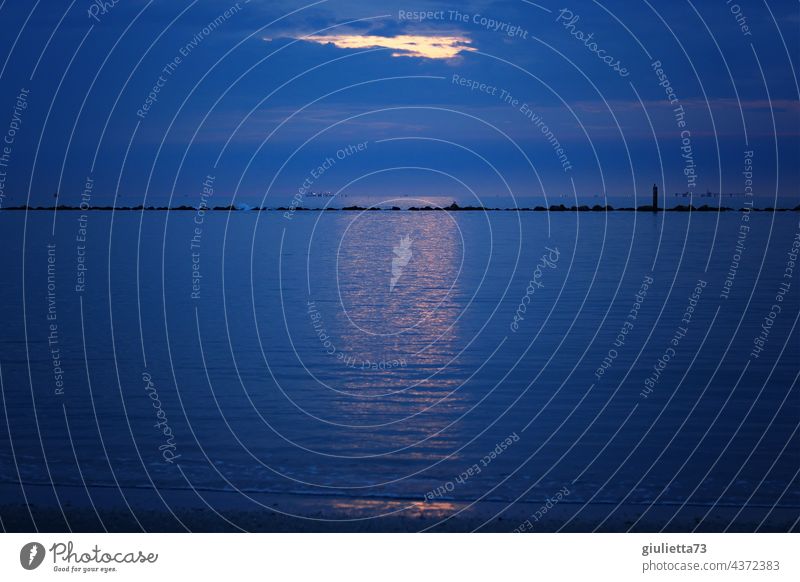 Spaces between heaven and earth | ...at the blue hour, sunlight shines through a hole in the cloud cover Sky Heaven magical Light Light (Natural Phenomenon)