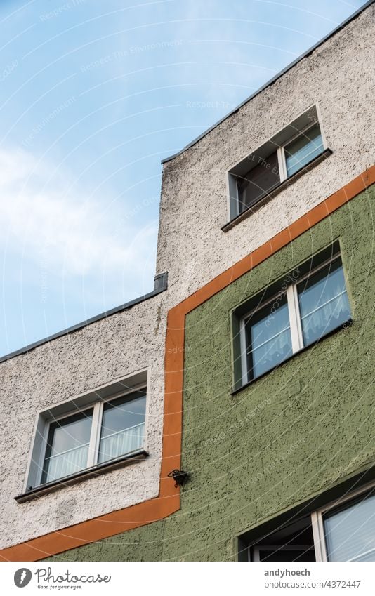 An orange line divides the facade of the house accommodation apartment apartments architectural architecture building city construction design development