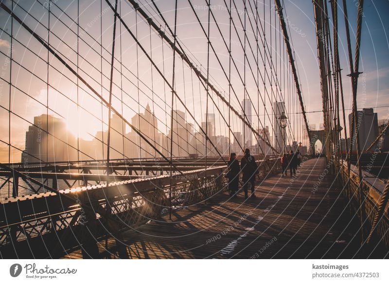 Brooklyn bridge at sunset, New York City. new york manhattan America brooklyn walk city skyline people usa skyscraper new york city cityscape romantic