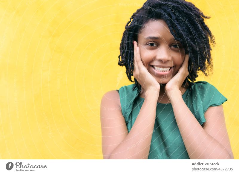 Portrait of a happy young woman in the street laughing african people portrait american model lady ethnicity afro beautiful smile happiness pretty joy outside