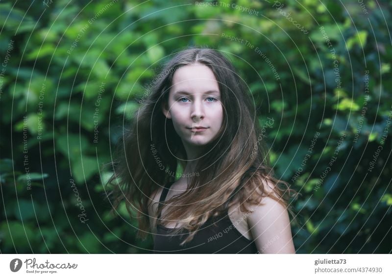 Summer portrait of long haired teen girl, natural beauty Colour photo Looking into the camera Exterior shot Green 13 - 18 years 15 16 16 years 15-20 years old