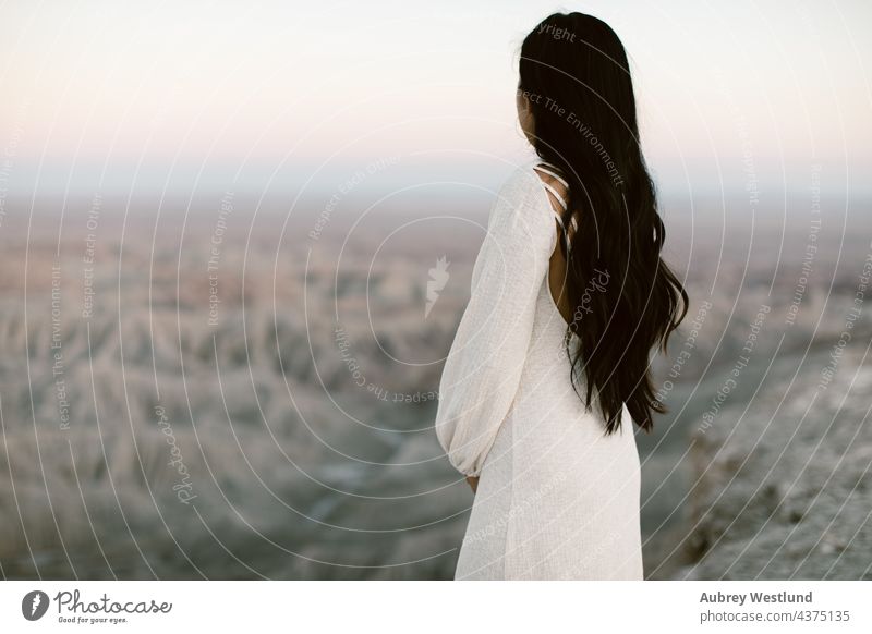 woman looking out at the desert Peaceful anza borrego desert asian badlands bohemian boho cacti cactus dark hair dressed up dusk emotion erosion evening