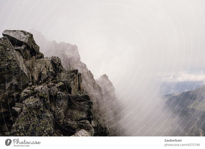 Rocks and fog in the South Tyrolean Alps Fog Clouds Peak Mountain Hiking curt Steep inhospitably