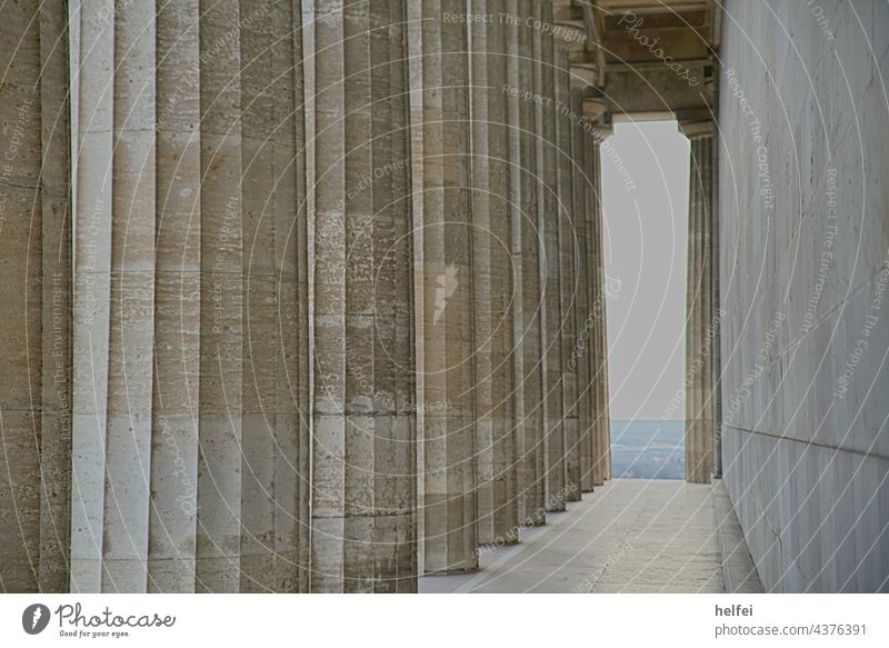 Columns of the Greek temple Walhalla with view into the Danube plain Regensburg Vantage point Architecture Corridor Far-off places Germany Clouds