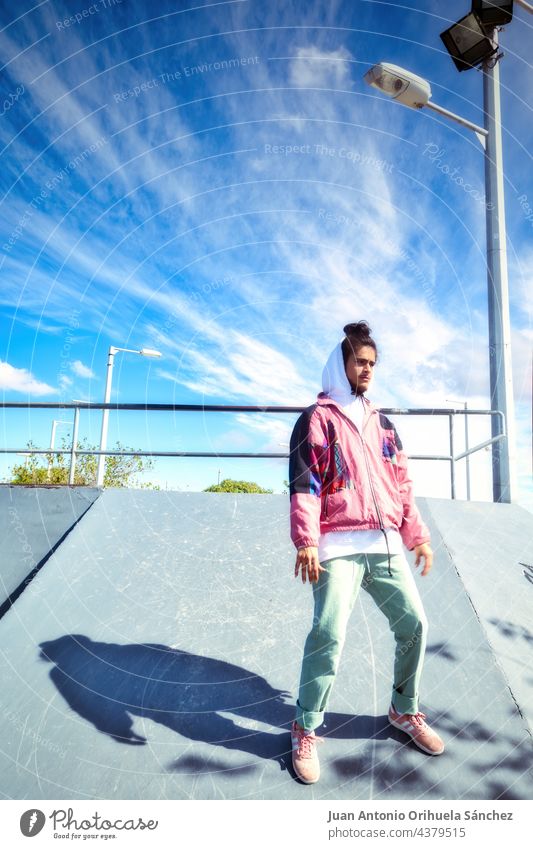 Full length portrait of a young skater dancing in a skate park teenager people man skateboard hip-hop freestyle pirouette twirl skateboarder casual dancer