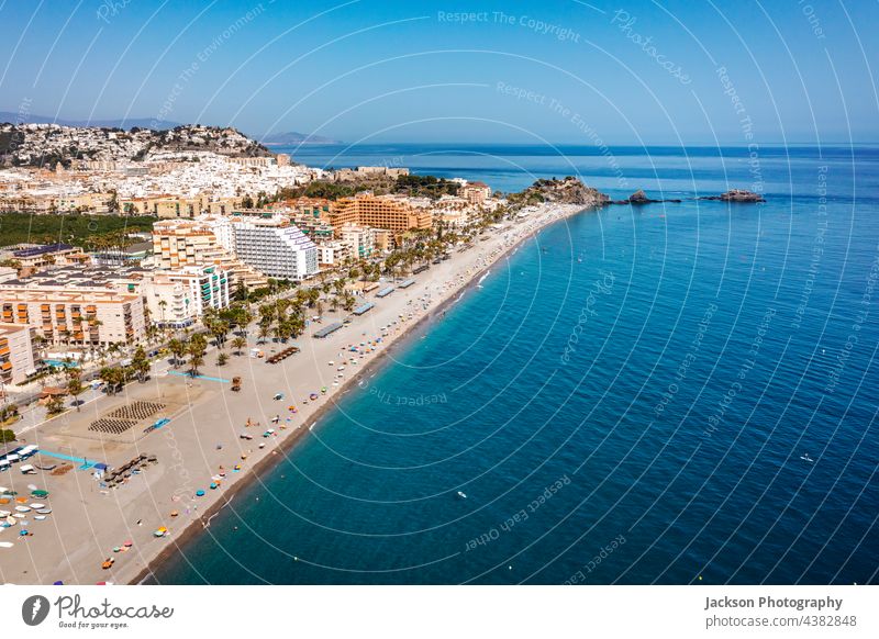 Aerial view of touristic coast in Almunecar, Andalusia, Spain spain almunecar beach urban andalusia mountain coastal day andalucia ocean seascape architecture