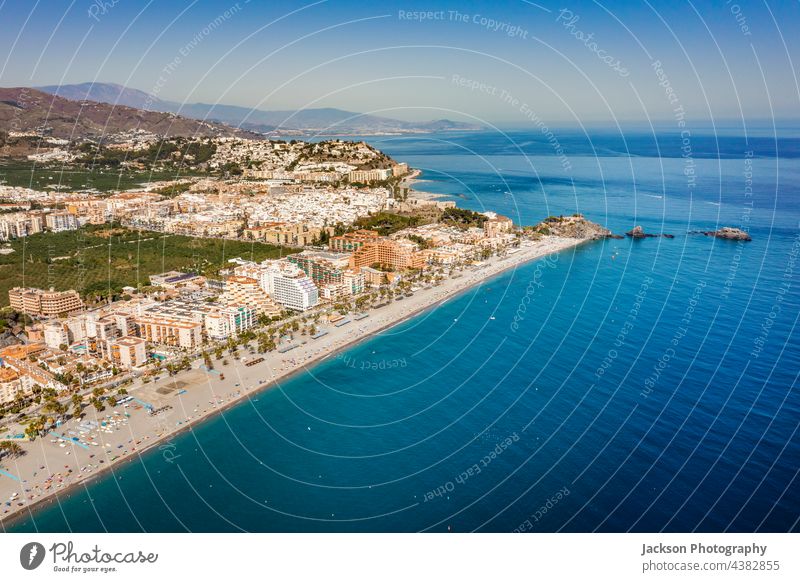 Aerial view of touristic coast in Almunecar, Andalusia, Spain spain almunecar beach urban andalusia mountain coastal day andalucia ocean seascape architecture