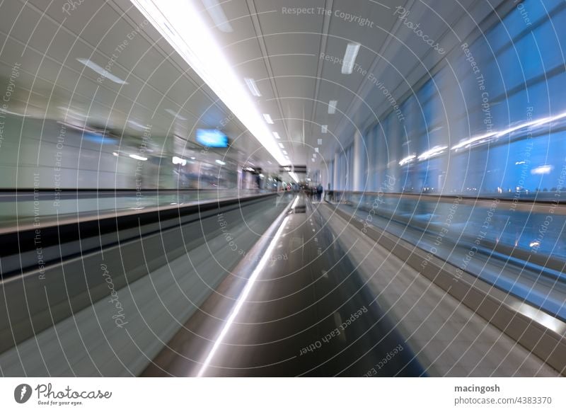 Passenger conveyor belt at the airport Moving pavement Airport Escalator Architecture Neon light Interior shot Modern Long exposure Movement Light Speed