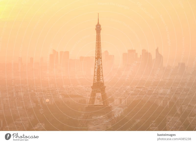 Aerial view of Paris with Eiffel tower and major business district of La Defence in background at sunset paris eiffel france skyline city travel landmark