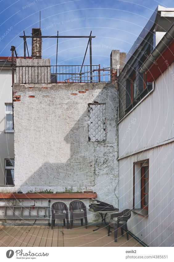 With neighbor's Roof terrace Beautiful weather Shadow Sunlight Window Sky cirrostratus clouds Plastic chairs Backyard Wall (building) Wall (barrier) Neighbours