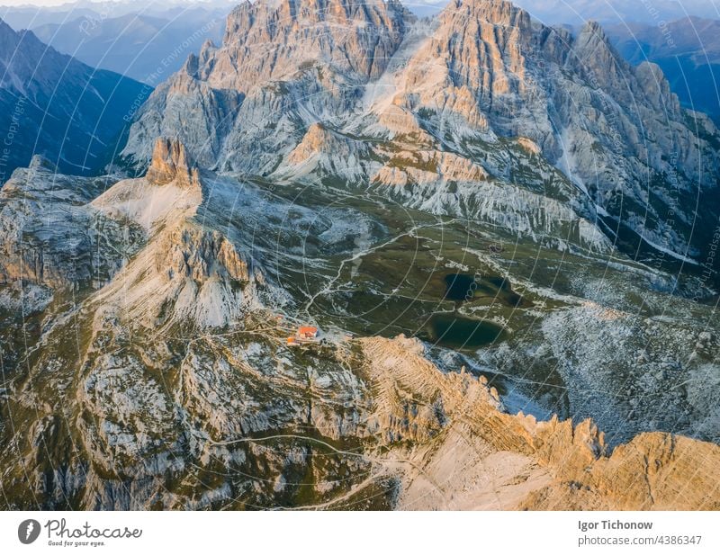 Aerial view of Dreizinnenhuette - Rifugio Antonio Locatelli close to Tre Cime di Lavaredo, Dolomites, South Tyrol, Italy famous aerial nature mountain sunset