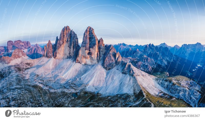 Aerial view of a woman hiker on mountain top enjoying Cadini di Misurina mountain peaks, Italian Alps, Dolomites, Italy, Europe dolomites aerial cadini