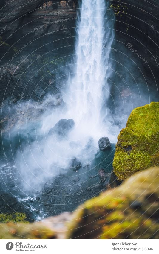 Close up of Haifoss waterfall in South Iceland. Water is crashing against the rocks on the bottom and splashing around. Defocused foreground iceland haifoss