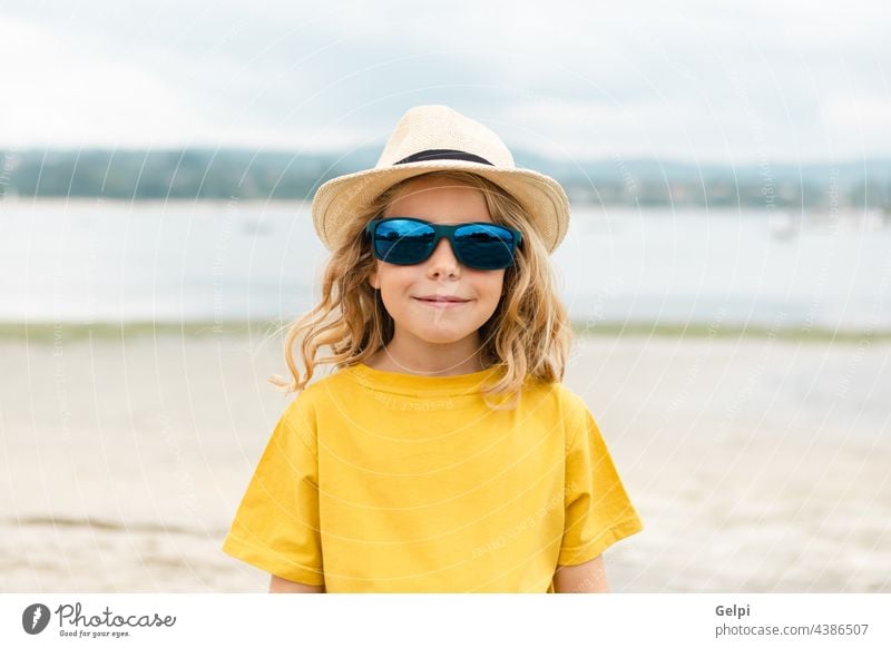 Happy child having fun on summer vacation sun blue holiday beach beautiful sea travel dream enjoy freedom imagination kid relax happiness yellow person