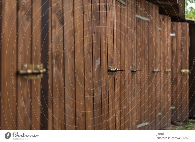 Many changing rooms changing cubicle changing cubicles locker rooms Wood Wooden door Lake Bathing meadow Bathing place Bathing establishment Behind one another