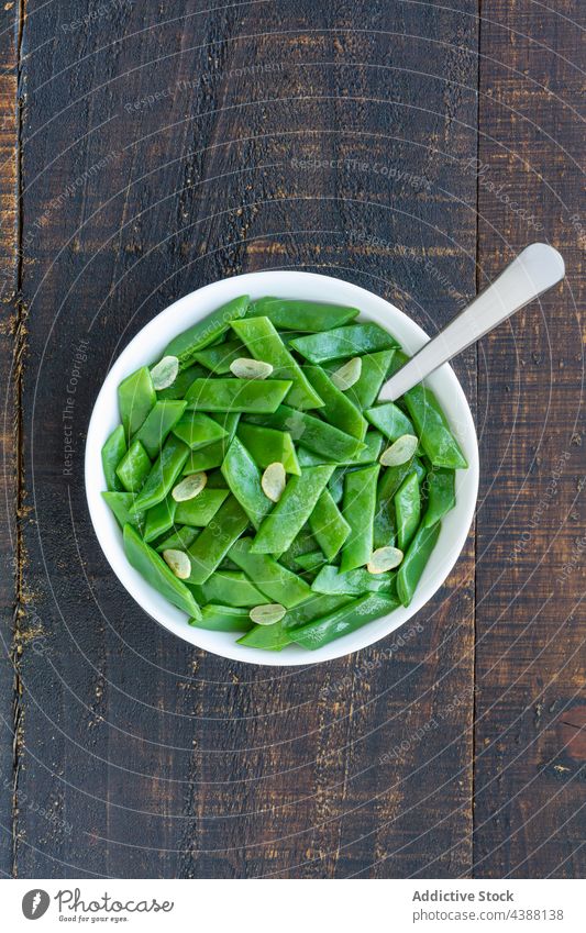 Tasty salad with green beans on table healthy food bowl serve vegetarian dish nutrition fresh delicious cuisine garlic slice natural tasty wooden organic