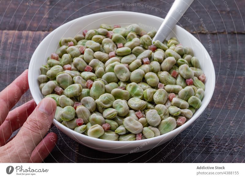 Bowl with frozen broad beans on table organic bowl natural healthy freeze cold nutrition rustic food serve pile culinary wooden cuisine product kitchen