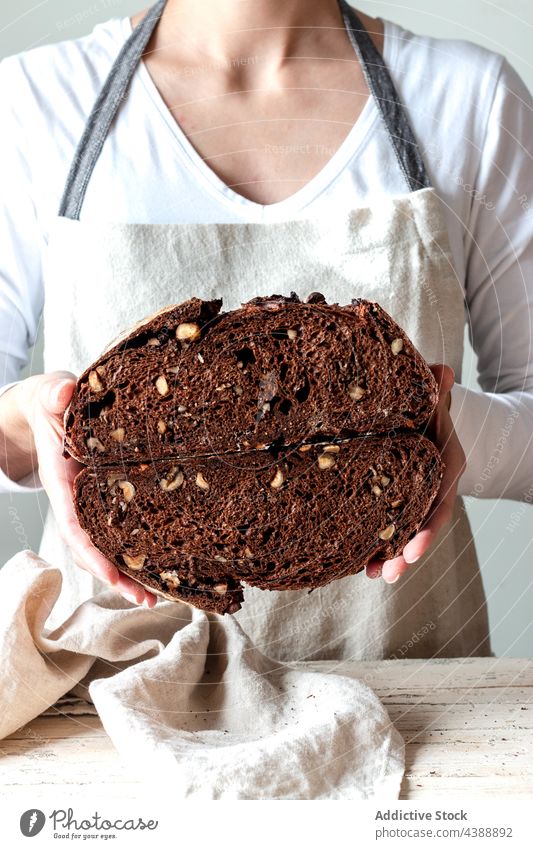 Hands holding freshly baked sourdough bread hand food rye healthy organic half grain woman baker delicious traditional soft flour tasty breakfast cereal natural