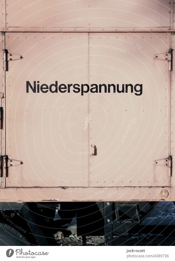 Low voltage in metal + on wheels Tension Energy Electricity Word Technology Energy industry German Station Metal door locked Hinge stream Mobility Substructure