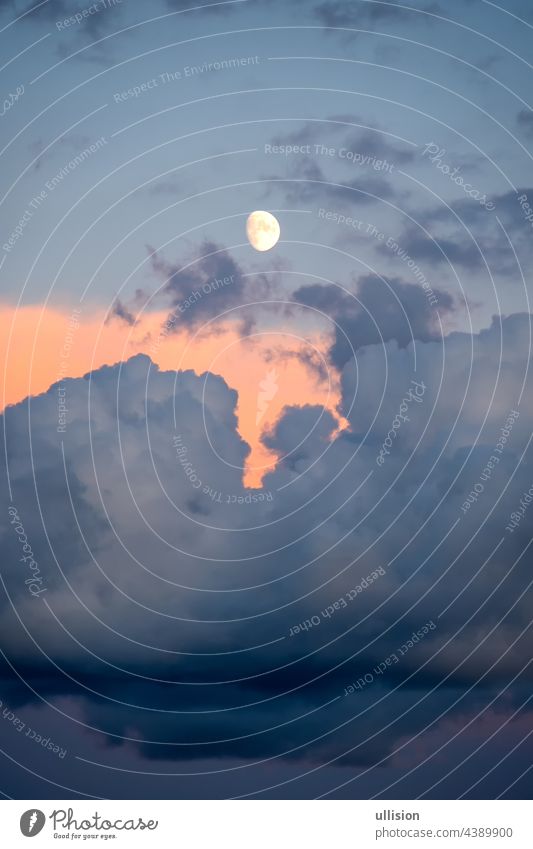 Full moon at sunset over a cloudy sky over the southern Italian sea afternoon hours mysterious romantic twilight moonlight color mystic heaven weather