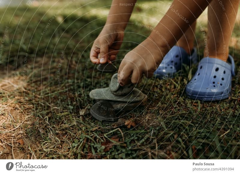 Close up child playing with rocks Child Close-up Hand Rock Balance Playing Infancy Colour photo Boy (child) Exterior shot Human being Joy Fingers 1 Day