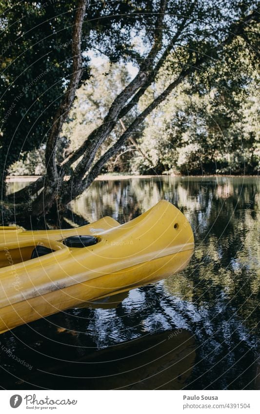 Kayak on riverside kayaking River activity canoe nature recreation vacation water travel paddle sport transport equipment boat horizontal journey tourism summer