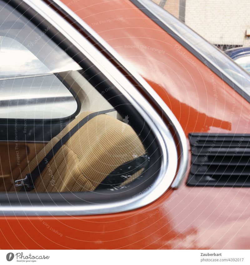 Rear window, beige back seat, C-pillar of an orange Youngtimer awaken childhood memories car Beige Orange Back seat Rear seat backseat bench 1970s 80s Chrome