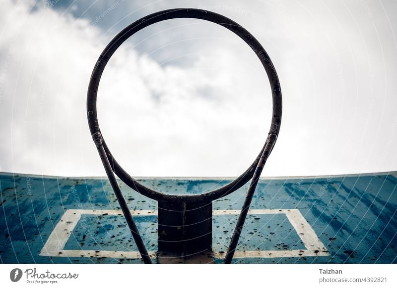 Directly Below Shot Of Basketball Hoop Against Sky. sport basketball net team hoop white blue sky basketball hoop court exercise game goal horizontal no people