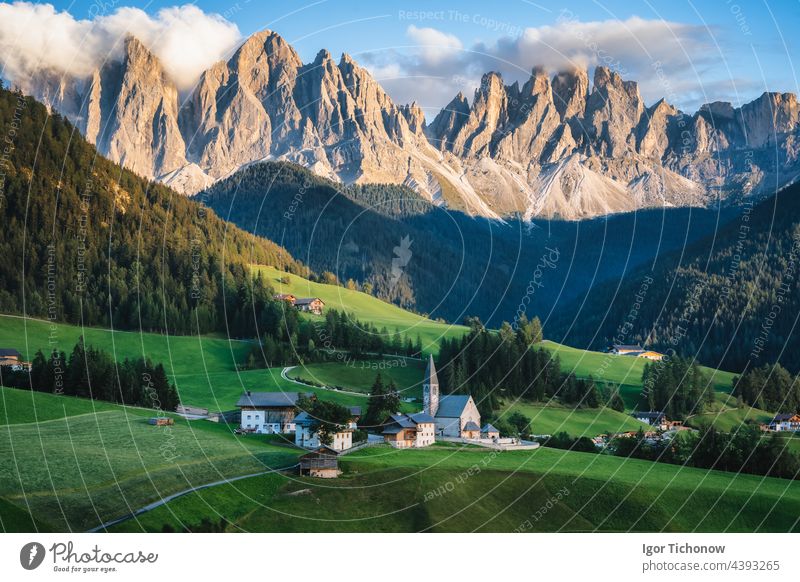 St Magdalena church in Val di Funes valley, Dolomites, Italy. Furchetta and Sass Rigais mountain peaks in background italy dolomites funes landscape nature