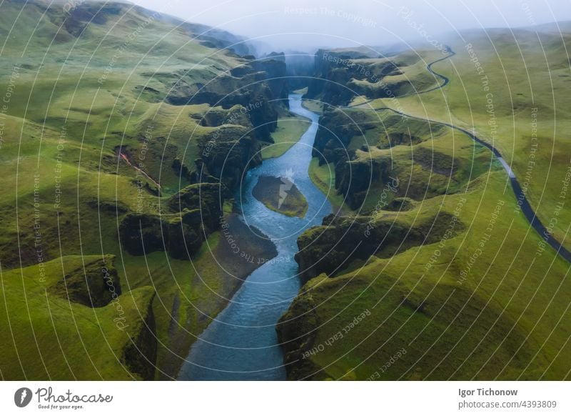 Aerial view of Fjadrargljufur Volcanic Canyon Iceland on moody overcast weather iceland aerial canyon fjadrargljufur drone volcanic landscape river nature