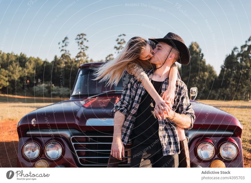 Loving couple kissing in retro car pick up vintage love embrace old fashioned summer relationship romantic hug valentine together bonding sit boyfriend