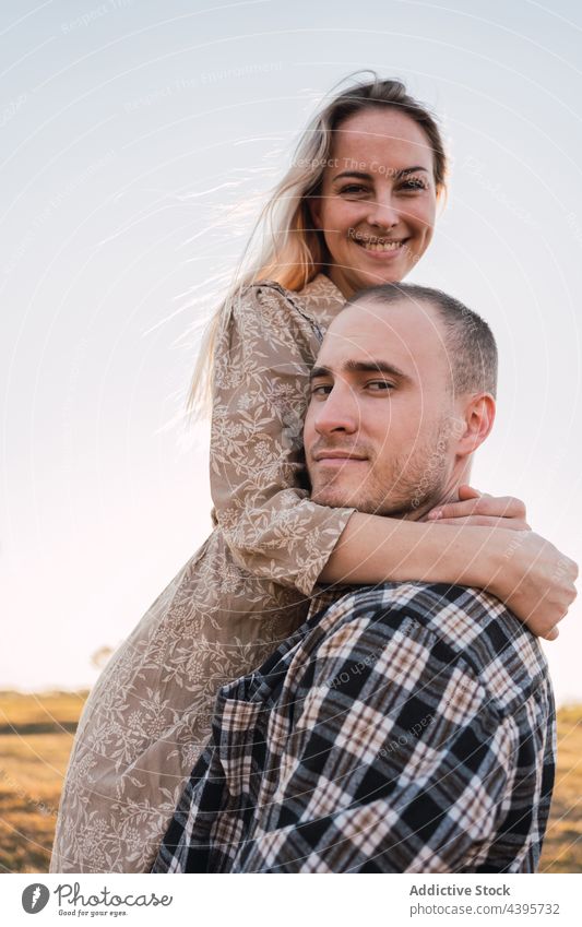 Couple embracing while looking at camera couple retro embrace love vintage old timer relationship together style happy trendy girlfriend boyfriend hug cool