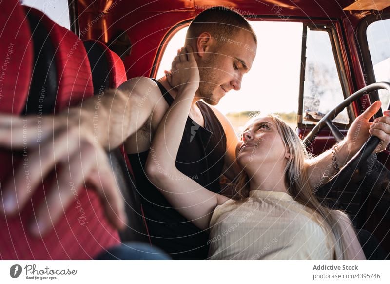 Content couple in retro car vintage love content relationship romantic old fashioned nostalgia vehicle automobile transport boyfriend girlfriend parked happy