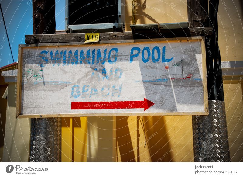 SWIMMING POOL AND BEACH Corfu Greece Tourism Vacation & Travel Signage English Pole Visual spectacle Facade Word Arrow Signs and labeling Road marking Right