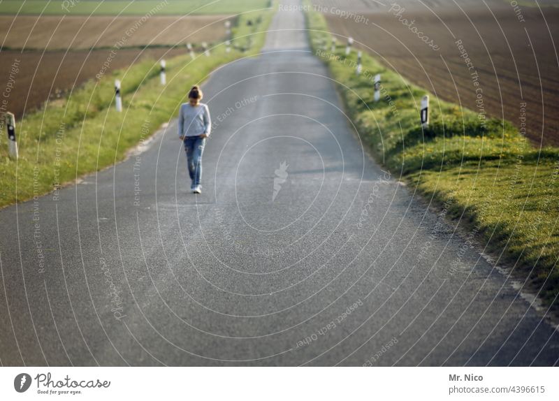 A long way back Lanes & trails Street Girl Freedom Far-off places Environment Field Right ahead Asphalt To go for a walk Going Single-minded Roadside In transit