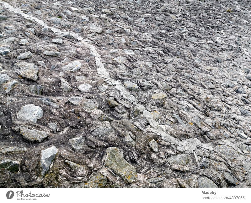 Massive coastal protection made of stone on the dyke at the harbour pier in Neuharlingersiel on the coast of the North Sea near Esens in East Frisia in Lower Saxony