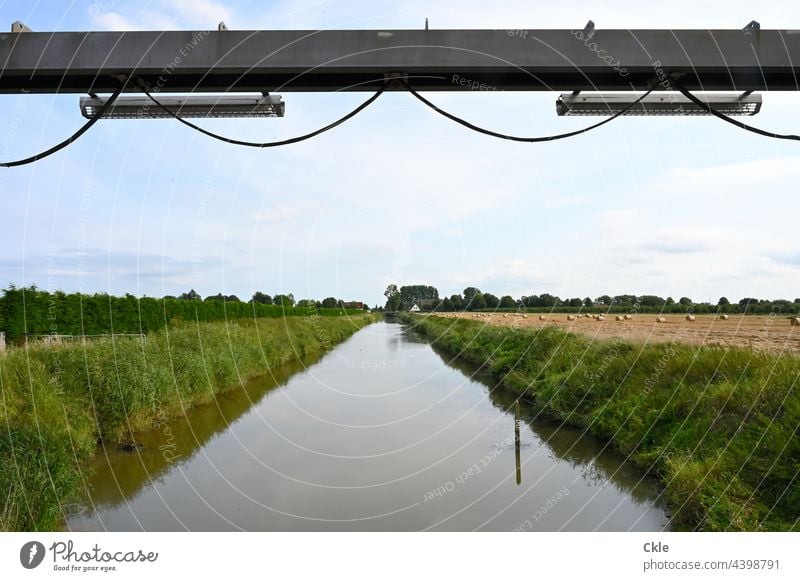 Flethwedder River Channel pumping station Dike fields meadows trees Water Old Dike march flood protection Cable Steel carrier Agriculture