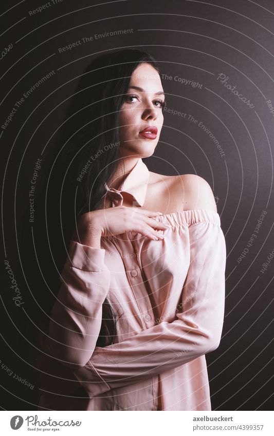 young woman in off-shoulder blouse strapless Blouse Young woman sexy Studio shot Feminine pretty Neutral Background Upper body Black-haired black background