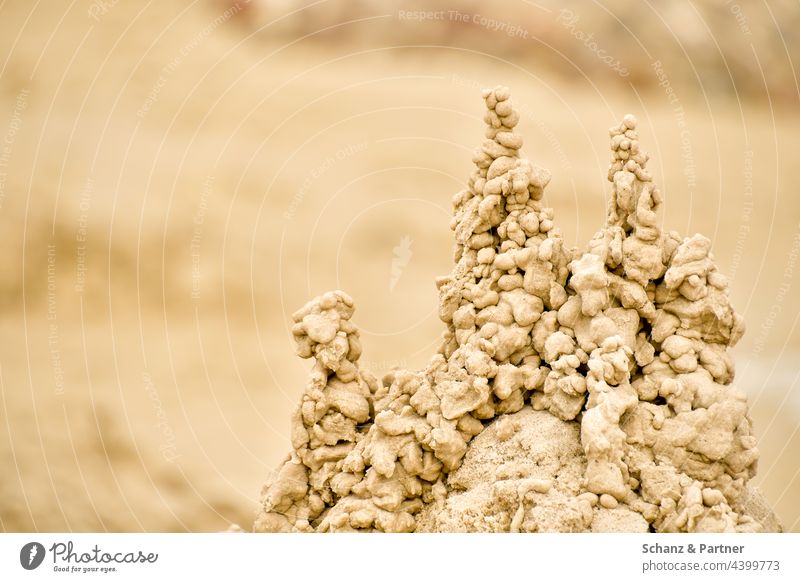 Sand Towers spires Beach Sandcastle piled up Playing vacation holidays starndurlaub Colour photo Summer vacation Ocean Exterior shot Infancy Building