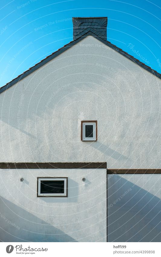 two windows in plain exterior facade of row house with garage and chimney Town house (Terraced house) unostentatious Simple Window Chimney Minimalistic