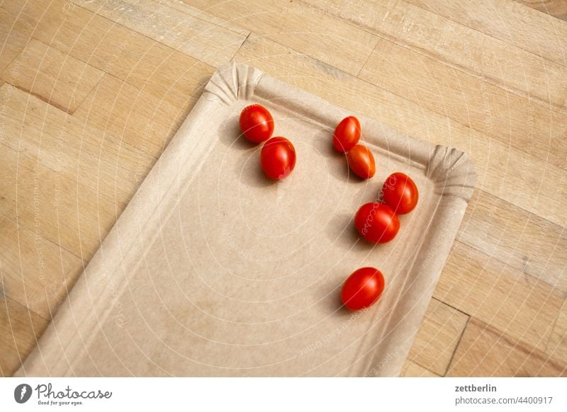 Seven small tomatoes on grey paper plate Tomato Harvest Fresh fruit Vegetable Plate paper plates Table Wooden table sieving Red Cocktail tomato Copy Space