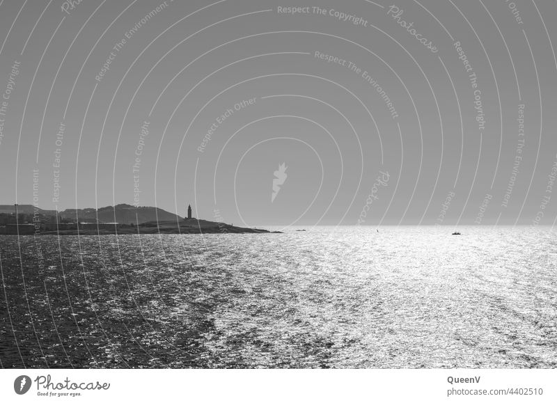 The Galician city of A Coruna and Hercules Tower seen from the sea A Coruña coruña Tower of Hercules Lighthouse Spain Black & white photo Ocean Sky Landscape