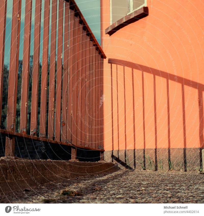 Shadow cast by a railing demarcation Protection Metal Safety Fence Border Deserted Orange Shadow play