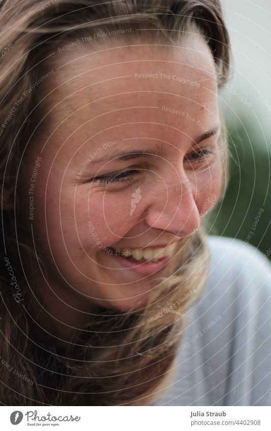 Beautiful Young Woman Laughs feminine laughs Laughter laughing Joy Show your teeth hair in the wind Hair on the face long hairs open hair brown hair pretty