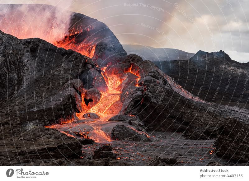 Active volcano under cloudy sky burn active erupt highland nature energy power fire cumulus dynamic landscape fagradalsfjall iceland scenic geology lava