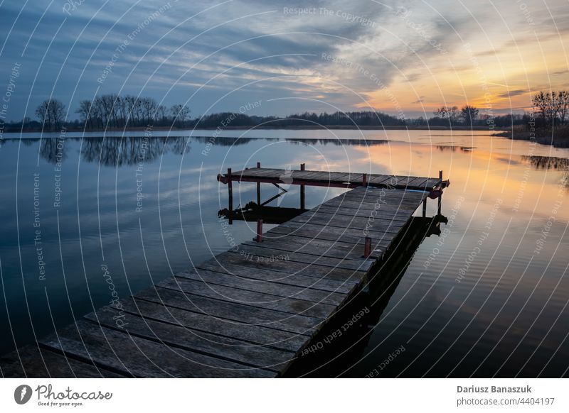 Wooden pier on a calm lake and evening clouds, Stankow, Poland nature sunset water sky outdoor wooden reflection landscape beauty dock nobody view relax