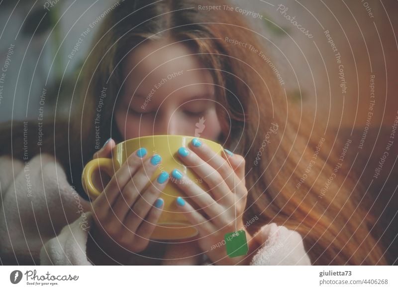 portrait, long haired teen girl drinking tea from big yellow cup Girl 13 - 18 years 16 16 years teenager Youth (Young adults) Interior shot Young woman